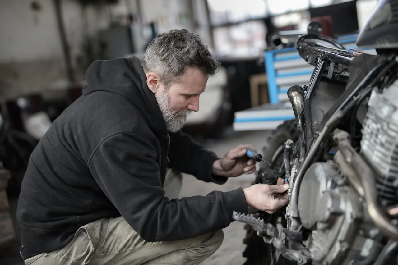 Technician at work in the Borderland Powersports Thompson service department